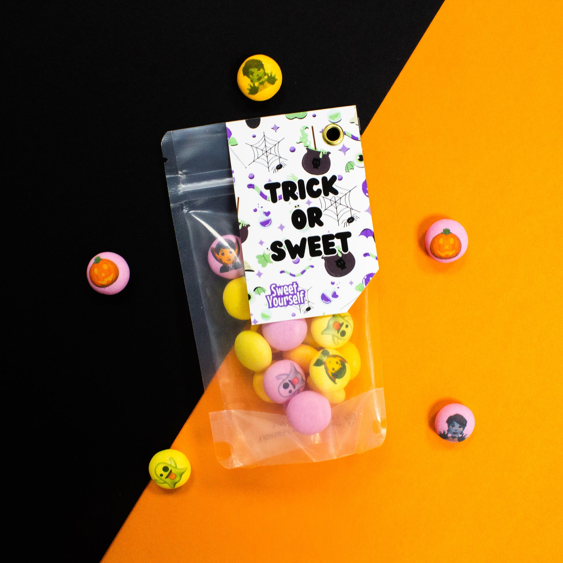 Customisable Trick or Sweet bag filled with fruity and minty Halloween-themed Mentos, featuring fun designs and personalised messages