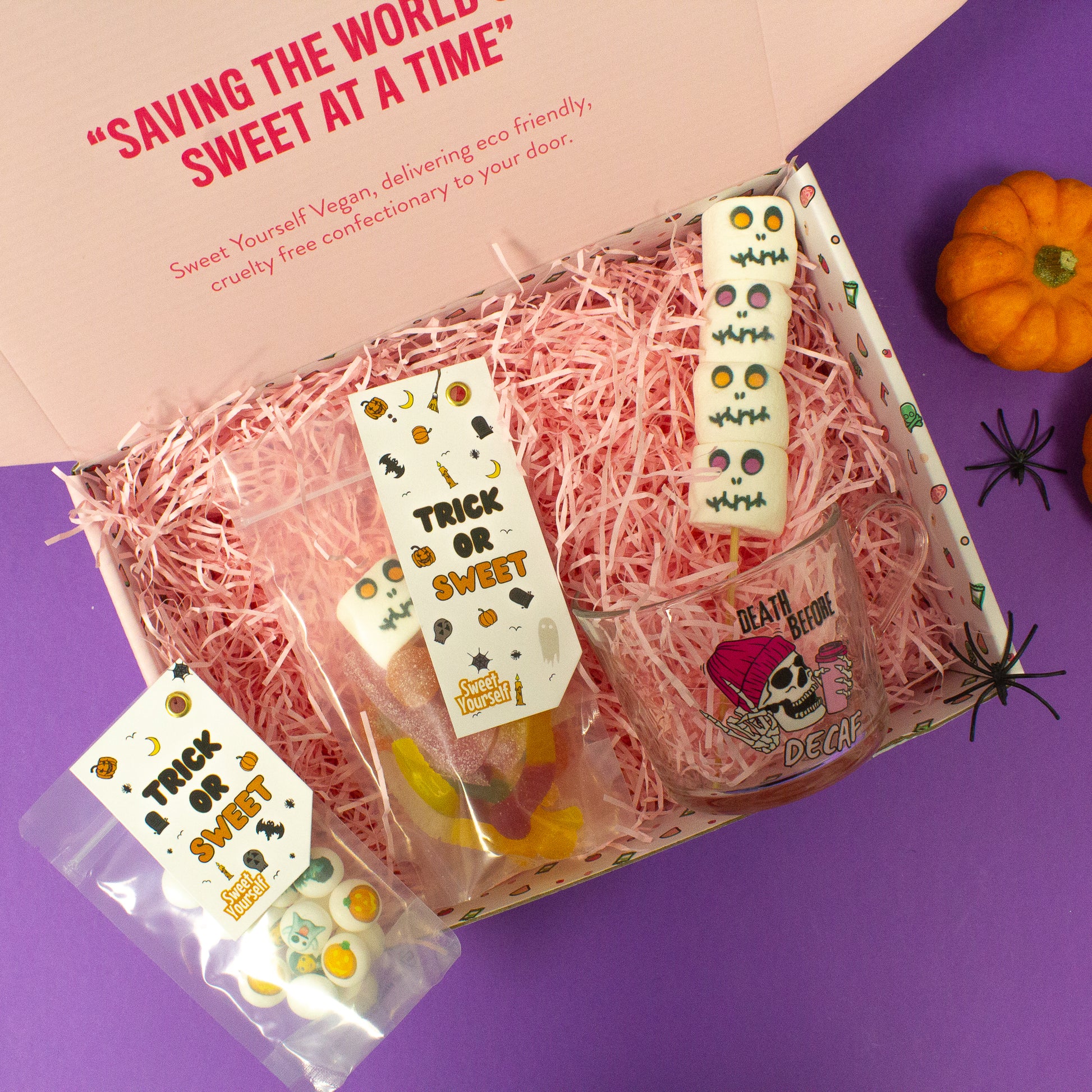 Halloween-themed gift box filled with vegan sweets, including marshmallows, gummies, and a ghost-themed cup, perfect for gifting to friends and family during Halloween